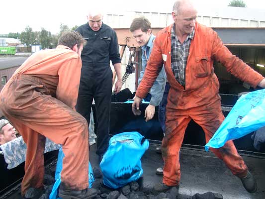 Up in the tender the bags were cut open and emptied. From the right Steve Underhill, Martyn Bane, Chris Brown, Leon Salter and just visible is Huw Button. September 25 2004