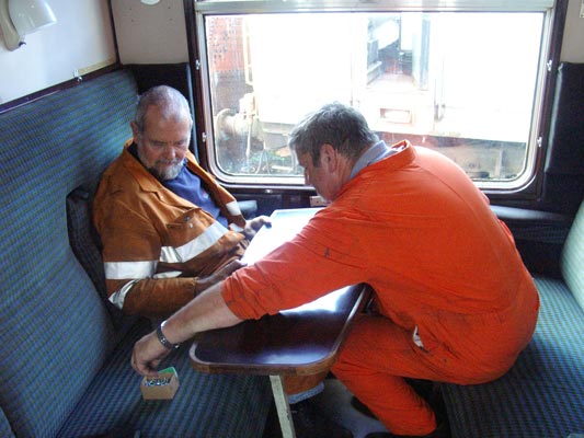 Colin Henderson (left) and Keith Lines make a mess of installing a new table. September 18 2004 