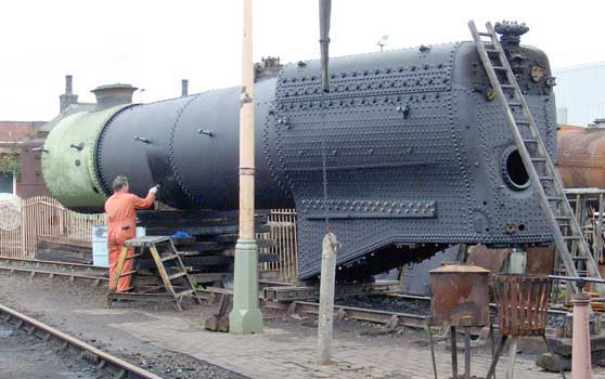John Salter finishes off painting the boiler barrel. May 01 2004