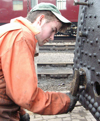 Leon Salter cleans rust from the face the blowdown valve seats against. Once done the face was covered in WD40 to prevent further rusting. May 01 2004