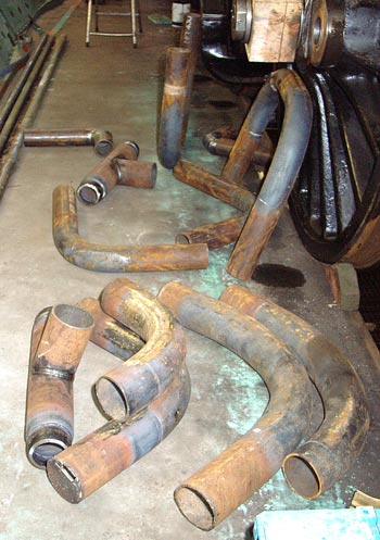 The new main steam pipes for the smokebox have arrived in bits. They now need to be assembled and have the relevant ends (left) welded on. January 03 2004