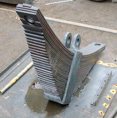 The spare rear driving axle spring as it arrived from be refurbished. As can be seen several of the leaves have been renewed. The new leaves are a different colour to the old ones as they have yet to rust ! May 01 2004
