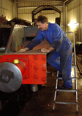 Graham Hopes rubbing down part of the front running plate. November 2 2003
