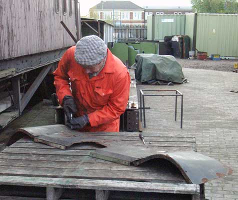 John Salter starts work on this piece of cladding from the rear of the firebox. November 15 2003