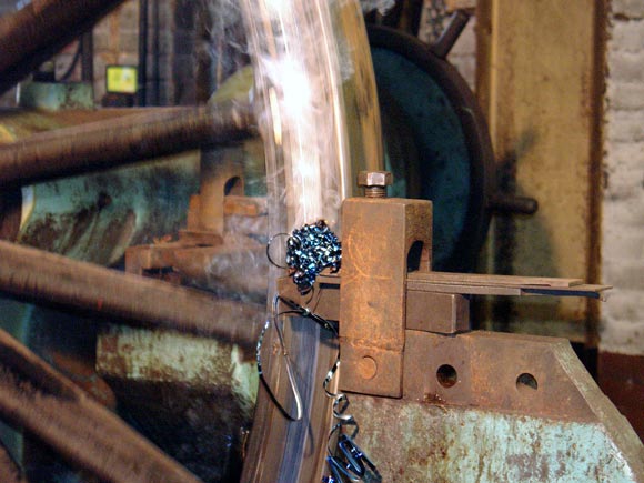 The wheel lathe in action removing the righthand side Gibson ring. The rear face of the tyre was turned down releasing the Gibson ring for re-use with the new set of tyres. November 2 2003