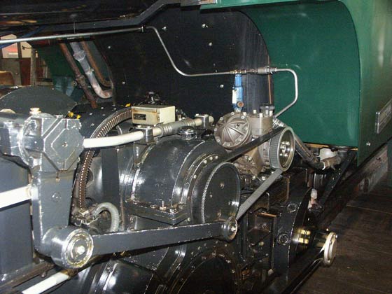 The locomotives are equipped with a water pump to replenish the boiler whilst on the move. It was felt relying on an injector risked distracting the driver in the event it bit no pick up immediately. As can be seen the pump is driven by a toothed rubber drive belt, the drive for which is derived from the valvegear. The pump does not feed cold water, rather it feeds water that have passed through a feedwater heater. A non-lifting injector is provided for when the locomotive is stationary. October 8 2003