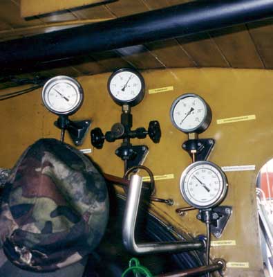 There are a few gauges in the cab, but not as many as might be expected on a modern machine. Modern does not have to mean complicated ! The gauges shown include a boiler pressure gauge and a superheated steam temperature gauge. August 16 2000