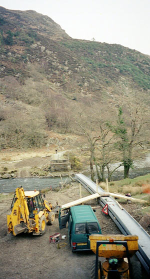 Work was in hand to construct a new footbridge across the River Glaslyn at the Beddgelert end of the Aberglaslyn Pass, known at Bryn-f-felin. The WHR trackbed can clearly be seen on the far side of the river. March 28 2003