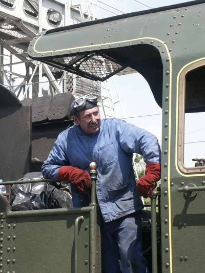 One of the loco crew during the pathing stop at Ch&acirc;lons-en-Champagne. If you know who this is or it is you please let me know. Thanks ! Note the coal briquettes stacked in the tender. May 28 2003.