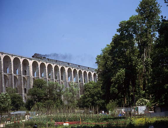 231G558 crosses the massive three tier Chaumont Viaduct with the Paris bound 'Alsace Lorraine Express'. June 1 2003