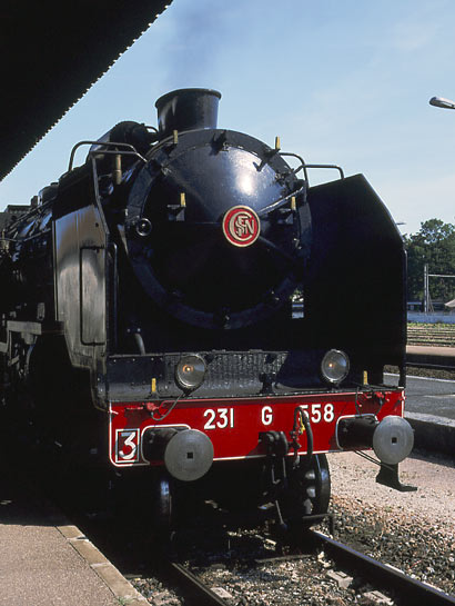 Looking like this 231G558 could not be anything other than a French loco. The smokebox door gives it away as much as the brass SNCF roundel. Romilly-sur-Seine. June 1 2003