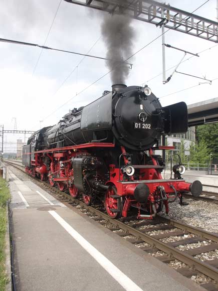 Another excellent loco. Former DR/DB pacific 01 202 is about to buffer up to the train at Zollikofen. Ready to run tender first back to Burgdorf. May 31 2003