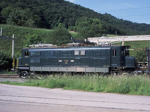 As side on view of Ae 4/7 11026 at Läufelfingen awaiting the cross with a local service. May 31 2003