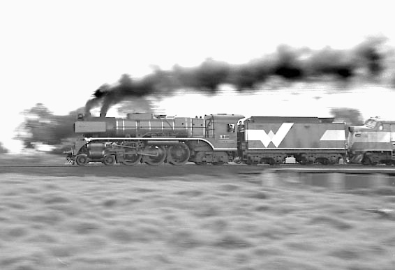 R711 & B61 accelerate away from Maddox Road crossing with the 08:48 Melbourne Spencer Street to Warrnambool service. August 2001.