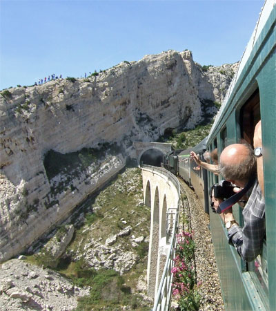 A viaduct followed by a tunnel - typical of the route. All along this section, not surprisingly there were lots of photographers as here on the cliff top.