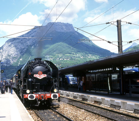 Grenoble is surrounded by mountains, as would be expected. Mikado 141R 1199 stands at the modern station ready for the next section of the run which took the train over the section of line towards Chambery. The initial part of this route was heavily rebuilt in the 1960s to remove the many level crossing to the south of the station.