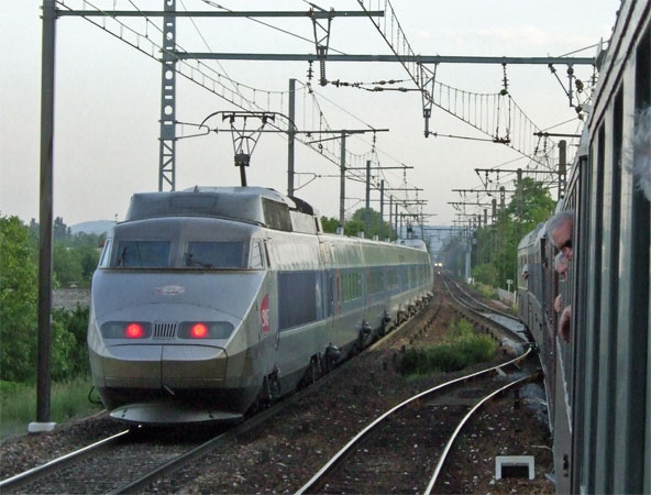 At Beaume we were stopped in the platform road to allow a service following close behind to overtake, the headlights of which can be seen in the centre background. In the other direction a TGV passed unusually slowly. 