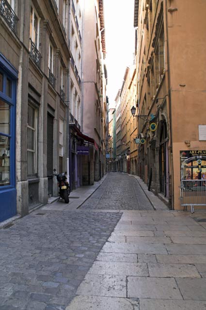 A typical old quarter street, but minus the normal hoardes of people - it pays to get out early! &copy; Brian Bane
