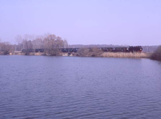 VIK 99 713 hauls the special train past the lake at Friedewald Bad. April 7 1996