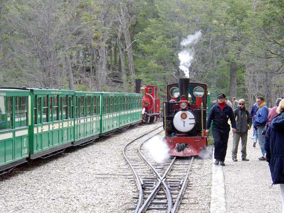 Two trains at Estación Parque Nacional. On the left No.2 waits to form the 12:20 to Estación del Fin del Mundo whilst No.3 has just arrived with am extra train made op of just two carriages. January 16 2004