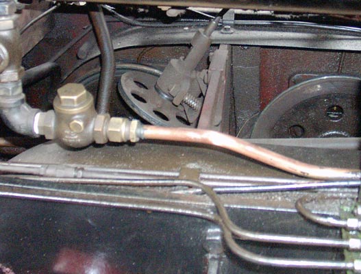 The wheel at 90 degrees to the driving wheel is the drive to the speedometer. Note the splashers over the driving wheels which help to keep oil and muck from falling on to the tread to ruin adhesion. April 11 2004