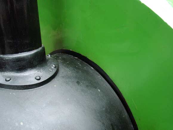 The saddle tank has been modified to suit the increased thickness of insulation. The black line indicates were the inner radius of the tank has been altered. June 11 2005 