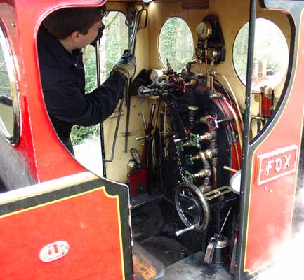 A view into Fox's cab as her driver hangs up a fire iron having just cleaned the fire. April 11 2004