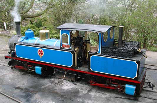 A side on view of 0-4+4-0t Hawk Clayton West. Note the chimney in the coal bunker. Exhaust steam from the rear bogie goes straight to atmosphere providing no draught on the fire but a percentage is now used as clinker control steam. April 12 2004