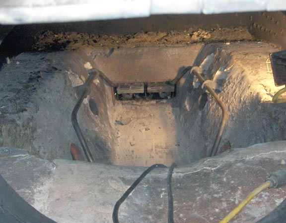 The firebox side view of the main burners in position with the pilot burner remaining to be fitted. Note the pipes on either side of the fireclay. These carry the atomising steam to the burners, in the process superheating the atomising steam to a high temperature. As with the burners these superheaters are made from 316 stainless steel. Also note the combustion air holes in the fireclay. � Sam Lanter