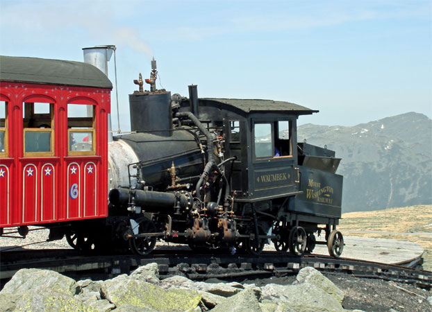 No.9 at the summit station on the Mount Washington Cog Railway during an early trial run in May 2006. Note that the chimney cap is in the closed position. © Nigel Day No.9 at the summit station on the Mount Washington Cog Railway during an early trial run in May 2006. Note that the chimney cap is in the closed position. © Nigel Day