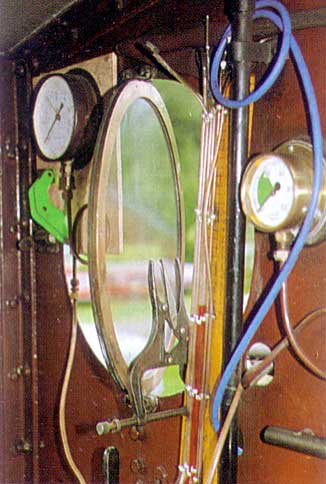 Inside No 85's cab on the test runs: the cylinder back-pressure gauge and smokebox vacuum gauge are clamped to the cab-sheet. © Shaun McMahon Inside No 85's cab on the test runs: the cylinder back-pressure gauge and smokebox vacuum gauge are clamped to the cab-sheet. © Shaun McMahon