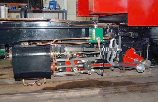 The cylinders are more or less to the original design. However the piston valves are of the 'correct' Porta type being lightweight, articulated and fitted with multiple rings of similar quality to those used in internal combustion engines. Thus steam tightness is considerably improved over traditional valve rings. This becomes especially apparent as wear occurs. The valvegear geometry was, in the original design, far from optimal. This has been corrected. Note all the proportional drive to the mechanical lubricator. The lubricator is to a design by Phil Girdlestone. © Phil Girdlestone 