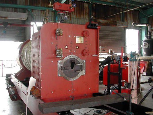 FCAF No.5's boiler sat in the cradle which sits on the two bogies. As can be seen the boiler is equipped with an external throttle linkage. © Phil Girdlestone 