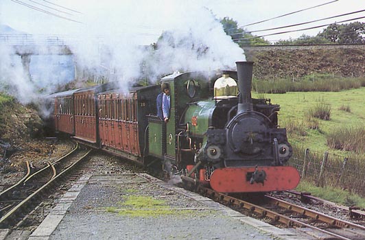 Shortly after conversion in 1985 Linda displays perfect combustion as she hauls an up train into Ddaullt. The Fireman is the FR's then Operating Manager Terry Turner. He is now General Manager on the Welshpool and Llanfair Light Railway. Behind him, just visible, is Phil Girdlestone monitoring performance. © G. Rushton