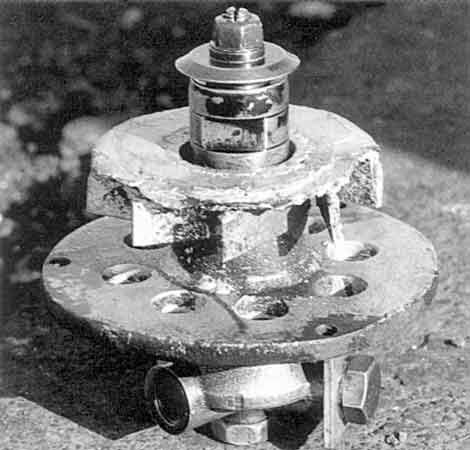 The heart of the beast. A burner unit removed for attention from a VoR loco. Note, apart from evident work erosion, the baseplate with steam holes, the swirl vanes above and the oil column centre. © Shaun McMahon