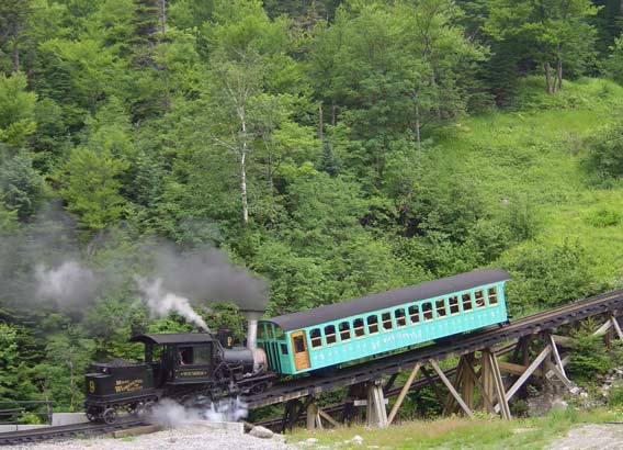 Mount Washington Cog Railway No.9 'Waumbek' sets off for the mountain. When this photograph was taken the locomotive had a Lempor exhaust nozzle and a number of other improvements. As can be seen combustion was not perfect, a function of the original design rather than the work undertaken. Despite the less than perfect combustion fuel consumption was substantially reduced. 18 July 2005. © N.A.H. Day