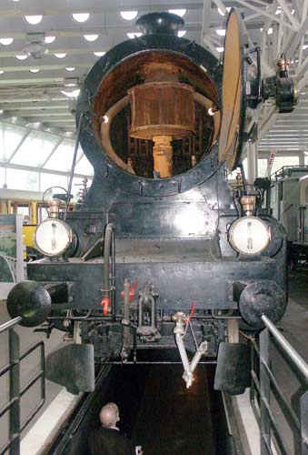 This is Class C5/6 2-10-0 4 cylinder compound 2965 which was built in 1916 for the SBB. It was not withdrawn from service until 1964. The high pressure cylinders are inside the frames. Note the lack of sharp bends in the main steam pipes and the spark arrestor cage around the blast pipe. October 4 2003