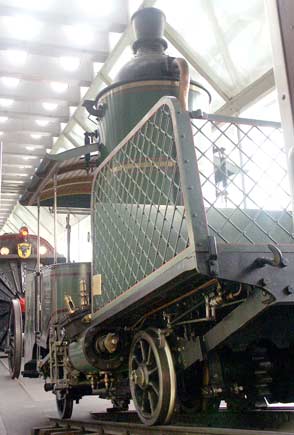 One of the very early Rigi locos, No.7, is on display. The locomotive is a rack only machine built in 1873. The large vertical boiler is very prominent ! Originally passenger travelled in the front section of the locomotive. October 4 2003