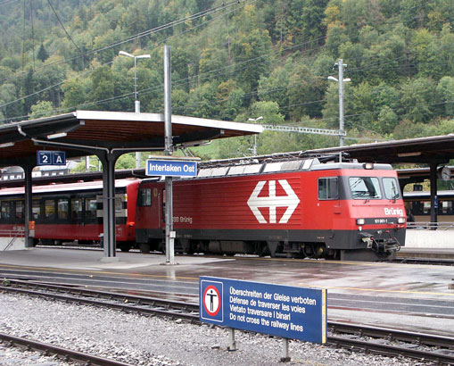 A SBB Brunig Pass line train for Lucerne was stood in Interlaken Ost station. It is headed by 2547hp HGe 101 961-1. October 5 2003