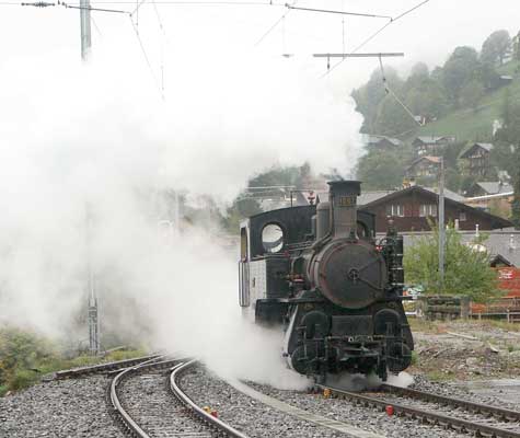 Back on the adhesion only section of Grindelwald loop 1067 runs towards the carriages. October 5 2003