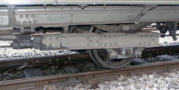 The central axle of the carriages is in a sort of bogie. This axle also had a rack cog for braking purposes. October 5 2003