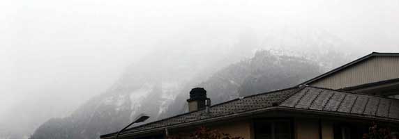 Not only did we get up late but the weather was not great ! This is the view from just outside of the hotel. The snow was welcome but the low cloud and biting cold was not ! October 4 2003