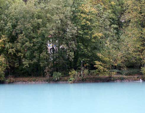 The waters flowing out of Lake Brienz through Interlaken are a strange blue colour and very cloudy. This is due to the minerals etc it carries as a result of being glacial melt water. October 5 2003