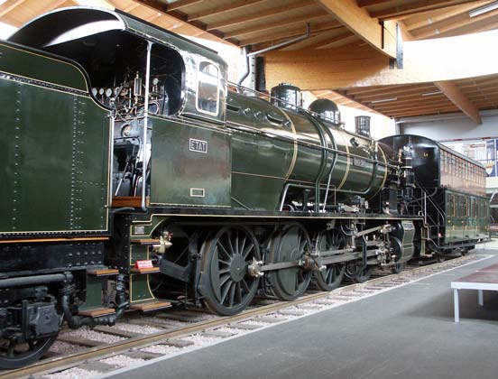 2-8-0 140-344 is an Etat system two cylinder simple. In SNCF days this locomotive was classified as class 140C. In front of the loco is an early double deck carriage. October 9 2003
