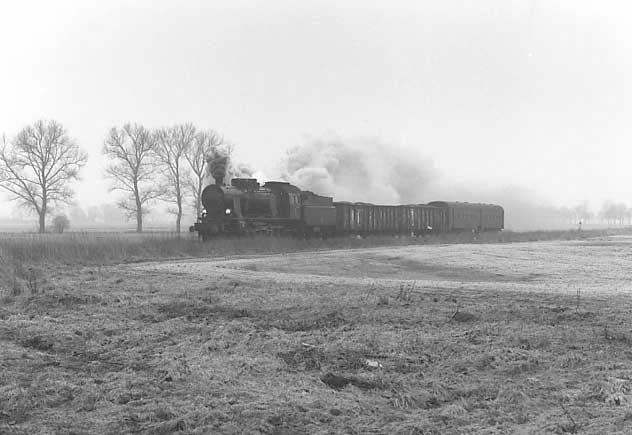 PKP 4-6-0 OK22 No.31 on a freight train south a few miles north of Plastowo. April 1996