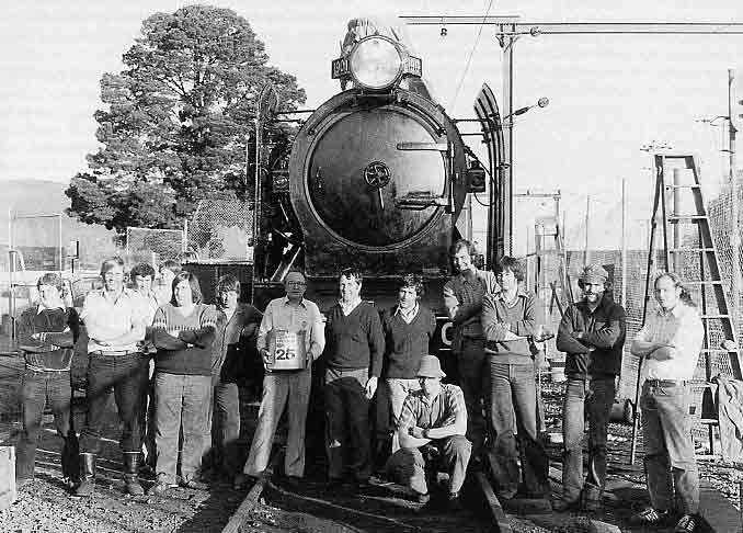 Towards the completion of K 190's restoration at Bayswater a group shot was taken of many Steamrail volunteers who worked on the project. They are (l to r) Adrian Kiely, Tony Marsden, (man with child unknown), Peter Keen, Ron Williams, Don Potts, Kevin and Tom Clark, Neil (surname unknown), Murray McEwan, Warren Banfield, Steve Bucton, Ian Morrison. October 1979. LATE GRANT GEDDES COLLECTION; COURTESY K. AND T. CLARK 