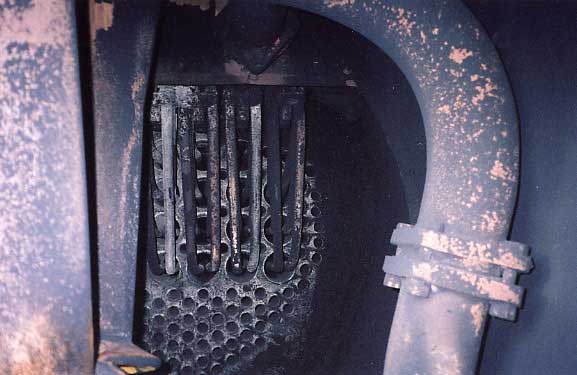 Inside the smokebox of R766 looking past the blast pipes to the smokbox tubeplate and the superheater elements.