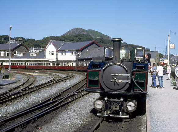 Locomotive on the 10 coach 10:20 to Blaenau Ffestiniog was Double Fairlie 0-4-0+0-4-0 Earl of Meirioneth seen here at Porthmadog Harbour station. July 13 2003