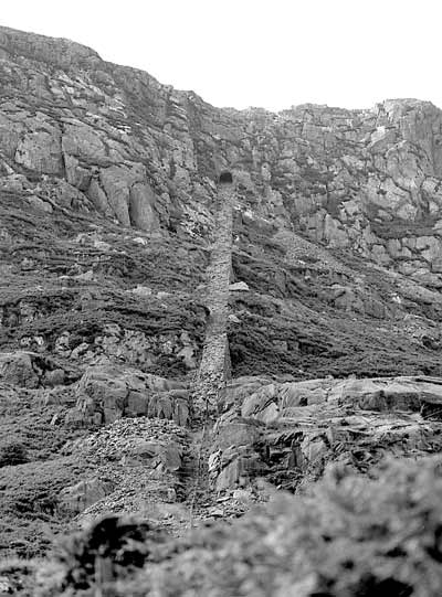 The area around Blaenau Ffestiniog is covered in the the remains of slate quarries. There are many inclines making their way up the hillsides. This shows the remains of the Wrysgan Quarry incline near Tanygrisau. It operated from the 1850s to 1946. July 13 2003