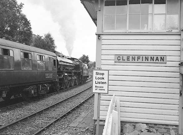 A brief stop is made at Glenfinnan for the token exchange. 61264 has plenty of&nbsp; steam to spare. July 8 2003
